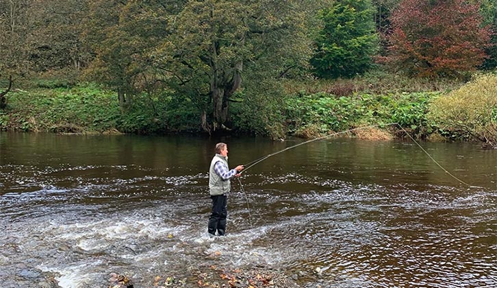 A person fishing at Riverside Caravan Park