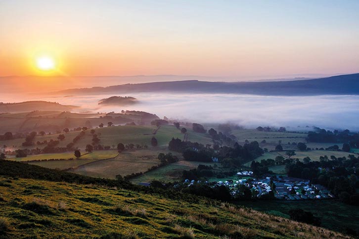 An aerial view of the sun rising at The Quiet Site