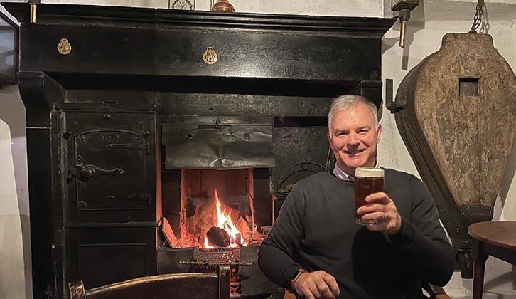 A pint by an open fire