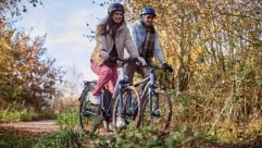 Two people cycling in the countryside