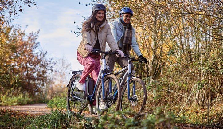 Two people cycling in the countryside