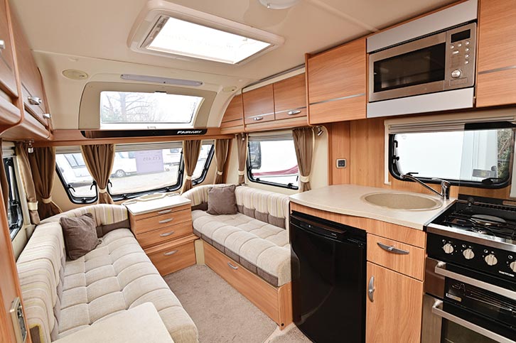 The lounge area of the van, showing the upgraded blinds