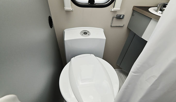 The toilet in the well-designed washroom