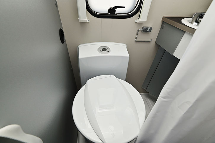 The toilet in the well-designed washroom