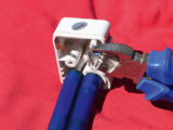 Using wirecutters, remove the two spade connectors