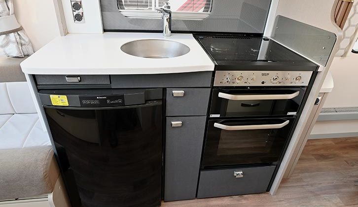 Side kitchen is well equipped and provides plenty of work surface