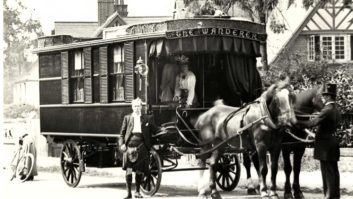 Man stands by horse drawn first ever caravan