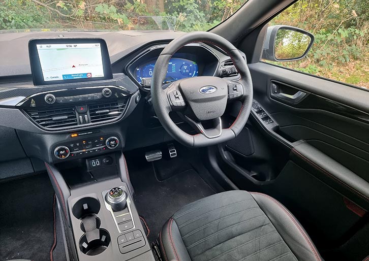 The cabin of the Ford Kuga 2.5 FHEV 190PS ST-Line X Edition FWD Auto