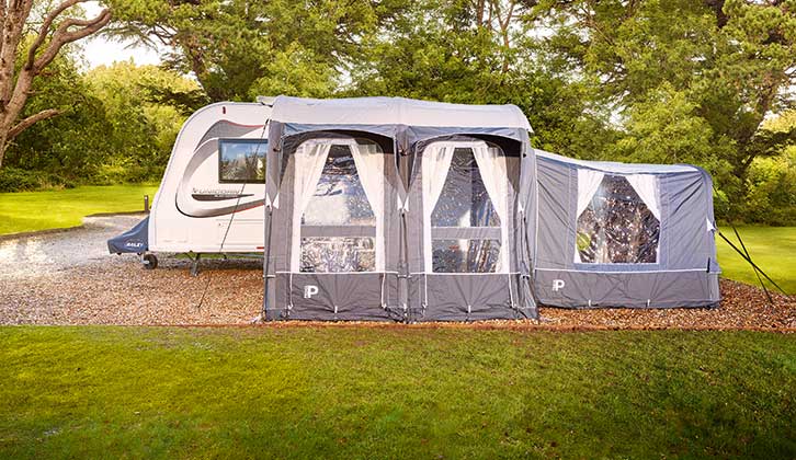 A pitched up caravan with awning