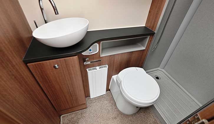 The washroom sink and toilet