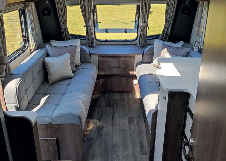 Lounge settees and large windows in Coachman Laser 665