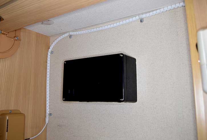 Assembled box mounted on inside of cupboard