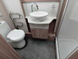 Washroom with radiator and handbasin
