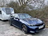 BMW 320i Touring M Sport towing Bailey caravan