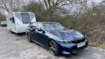 BMW 320i Touring M Sport towing Bailey caravan