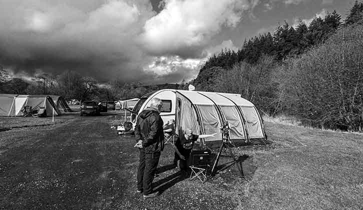 Telescope set up near caravan