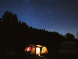 Caravan under night sky