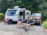 Nigel and Kay sitting by pitch