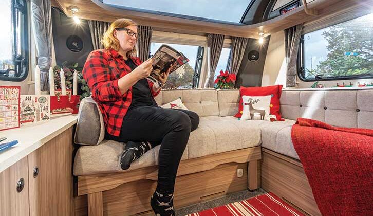 Reading magazine in caravan