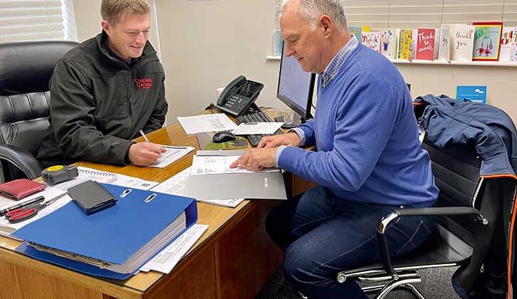 Tim and Nigel doing paperwork