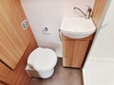 Toilet and sink in washroom