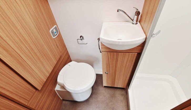 Toilet and sink in washroom