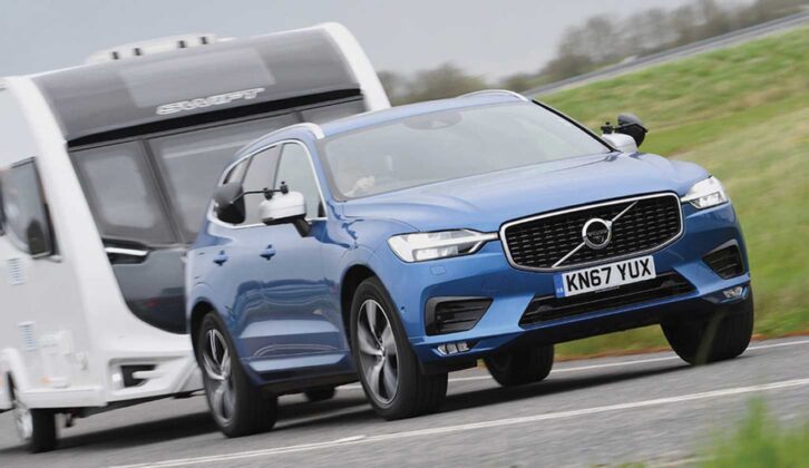 A Volvo XC60 towing a van