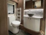 Washroom with toilet and handbasin