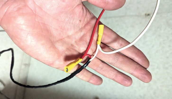 A hand holding connectors