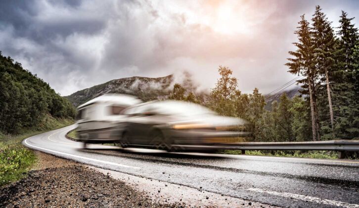 Blurred image of a car towing a caravan
