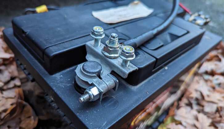New battery terminal and heavy-duty cable clamped in position