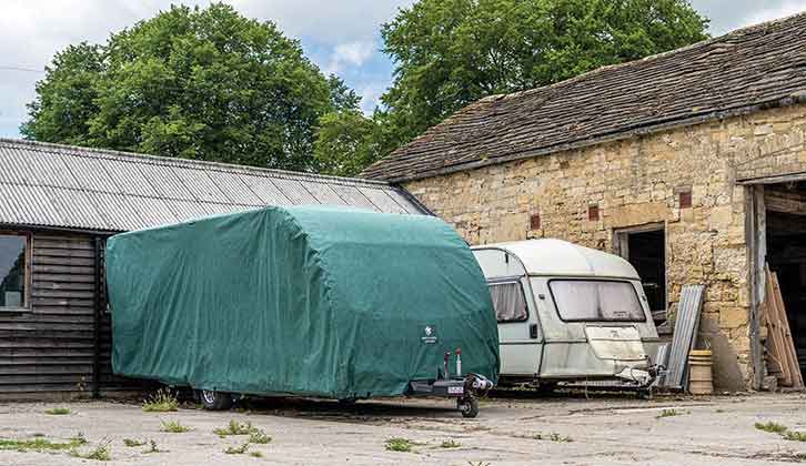 A covered caravan and a tourer without a cover