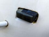 The cracked front marker light