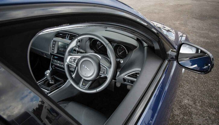 The steering wheel and dashboard of the XE