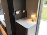 The touch-controlled table lamp by the door