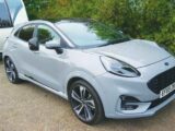 A Ford Puma towing a caravan