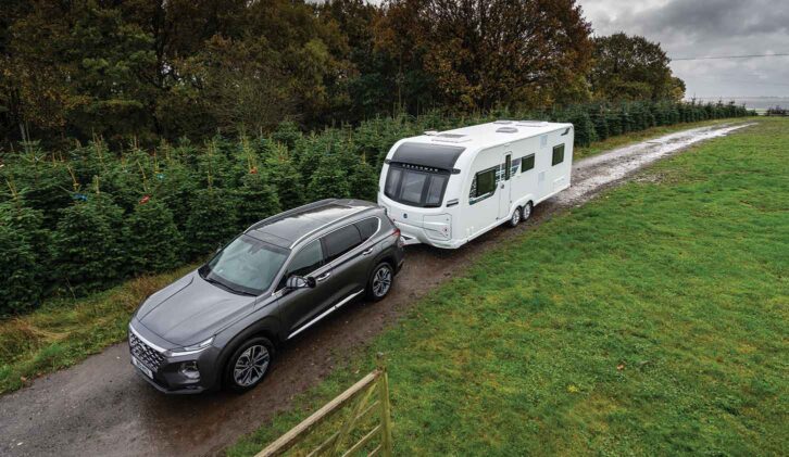 A caravan being towed down a country road