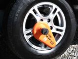 A caravan tyre with a wheel clamp
