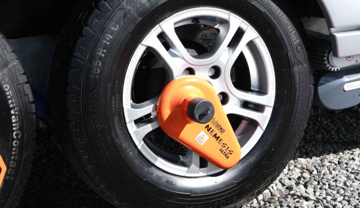 A caravan tyre with a wheel clamp