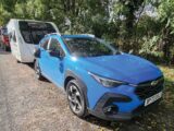 The Subaru Crosstrek 2.0i Touring hitched up to a Swift caravan
