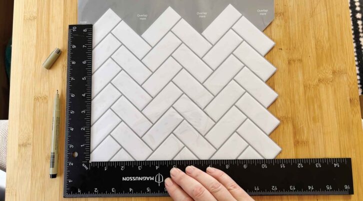 Measuring up the tiles for cutting