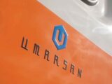 The Umarsan logo on the van