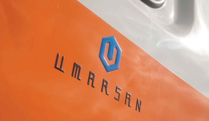 The Umarsan logo on the van