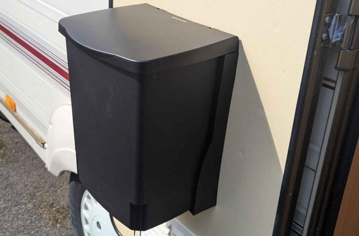 The bin, secured to the door