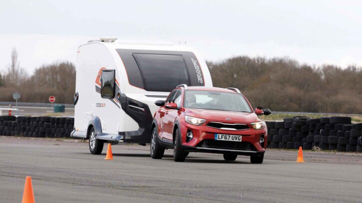 A Kia Stonic towing a caravan