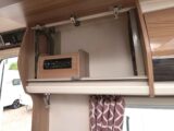 The radio in the overhead locker