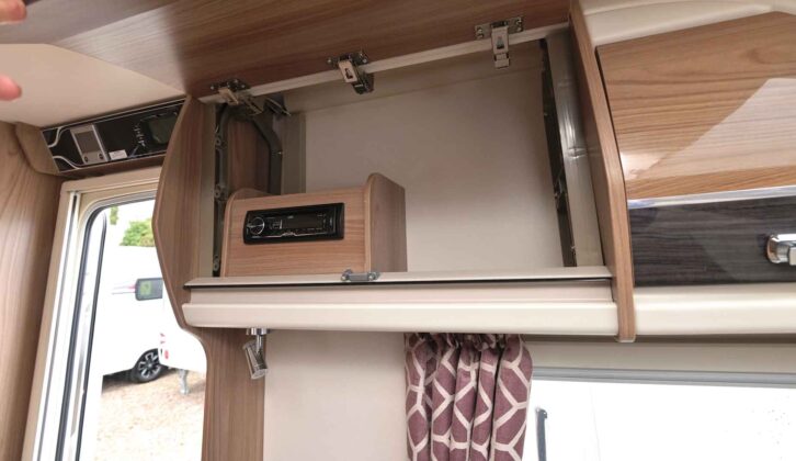 The radio in the overhead locker