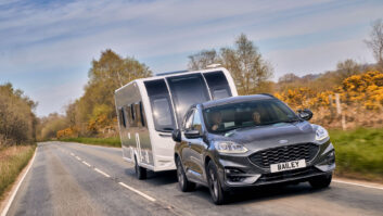 A car towing the new Bailey Phoenix Black Edition