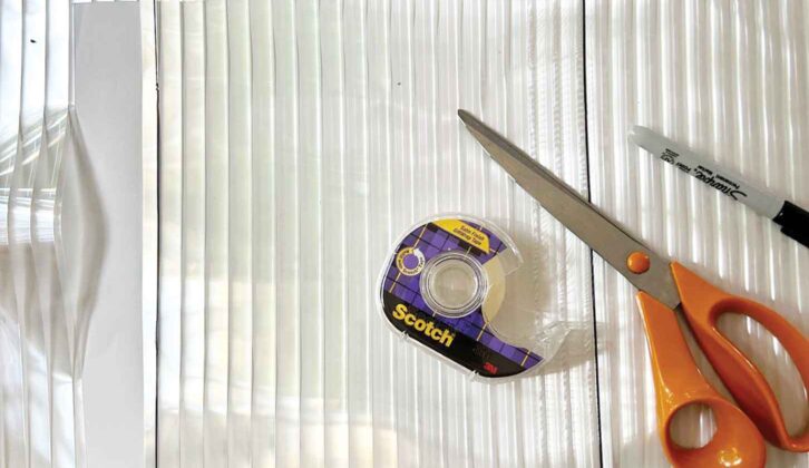 Fluted glass-effect film with scissors and tape