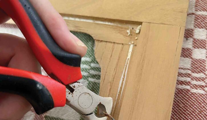 Removing a staple with pliers